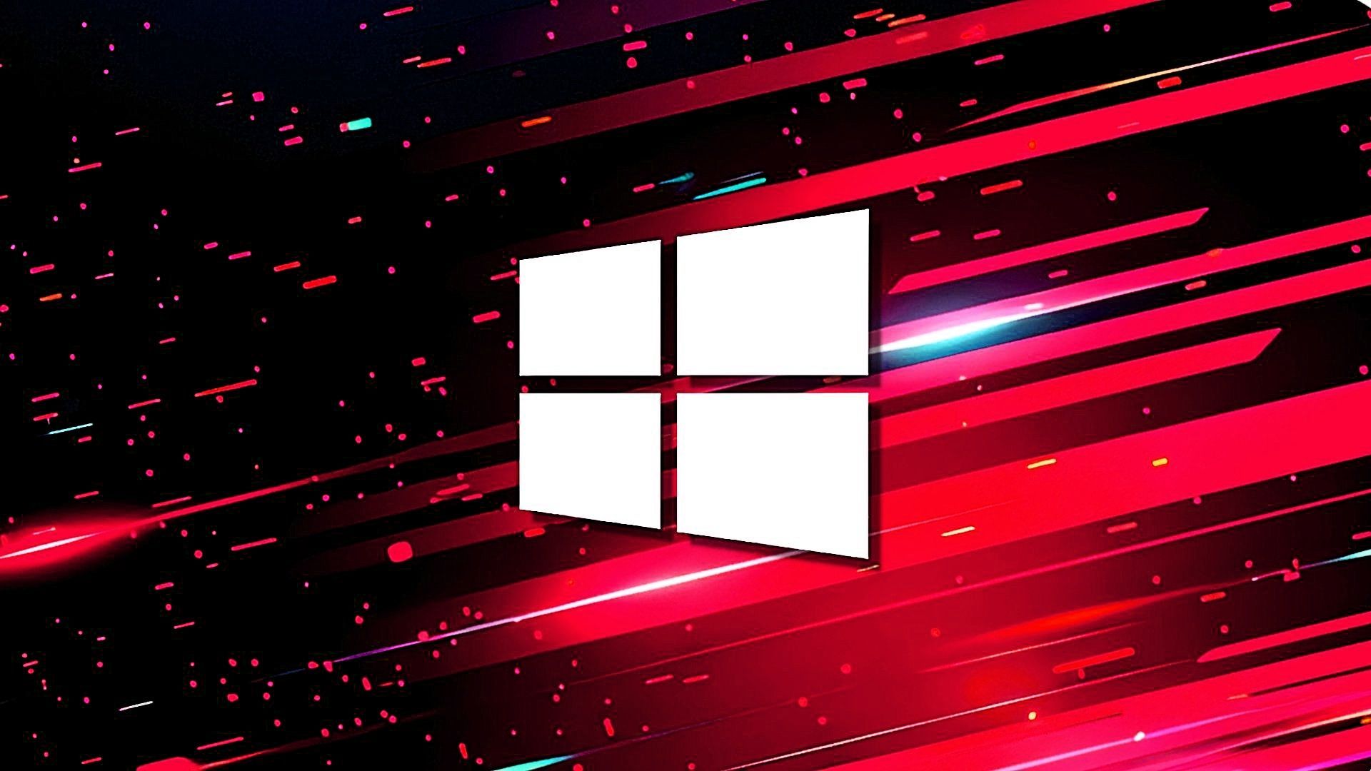 Logo de Windows en blanco, formado por cuatro paneles rectangulares en perspectiva, centrado sobre un fondo oscuro con franjas diagonales rojas y magenta que atraviesan la imagen, con destellos de luz y pequeñas partículas brillantes.